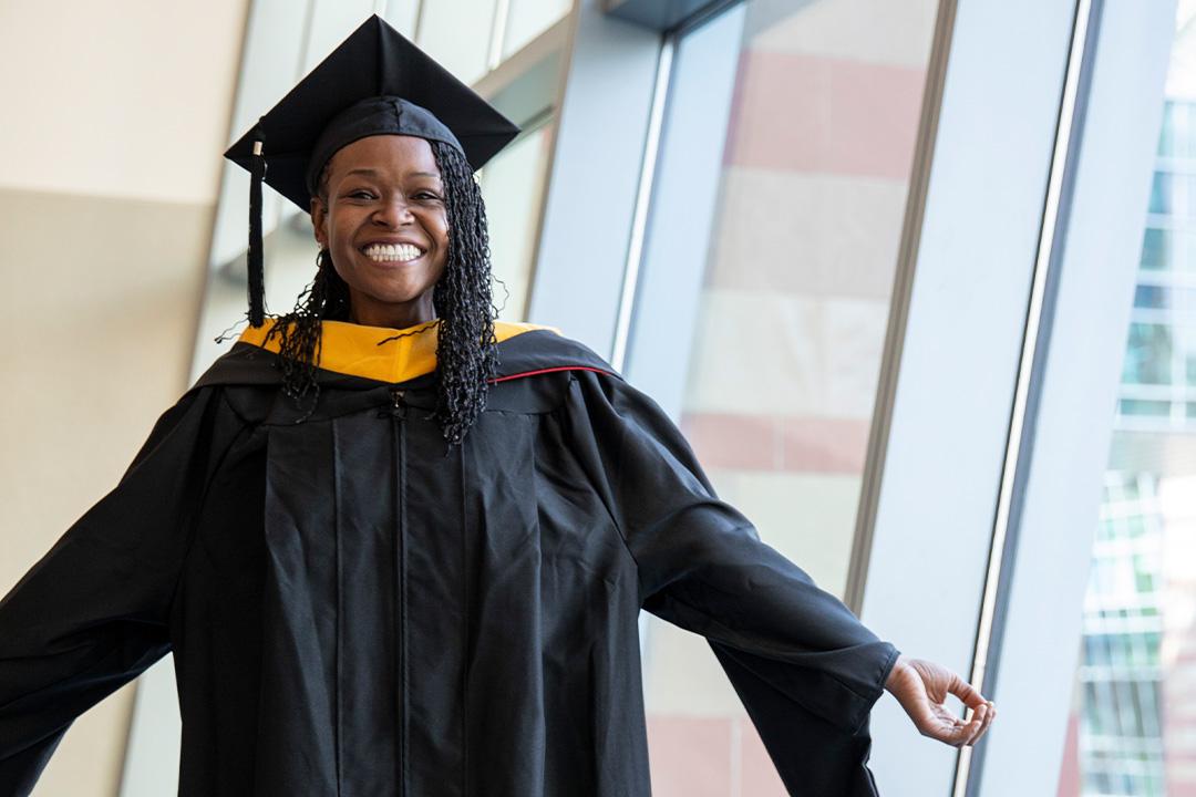 Happy UOPX alum in their cap and gown 